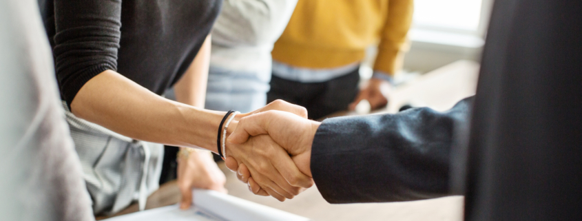 Business people shaking hands in office